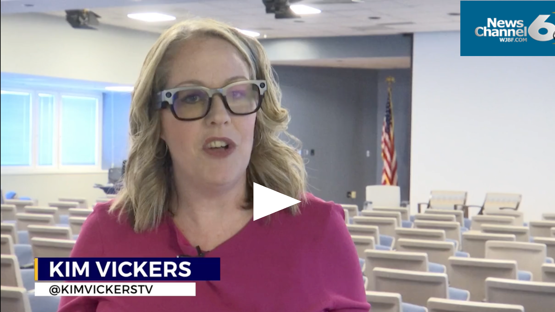 News anchor Kim Vickers facing camera reporting at the VA Innovation Summit, Augusta, wearing featured innovation, XanderGlasses 